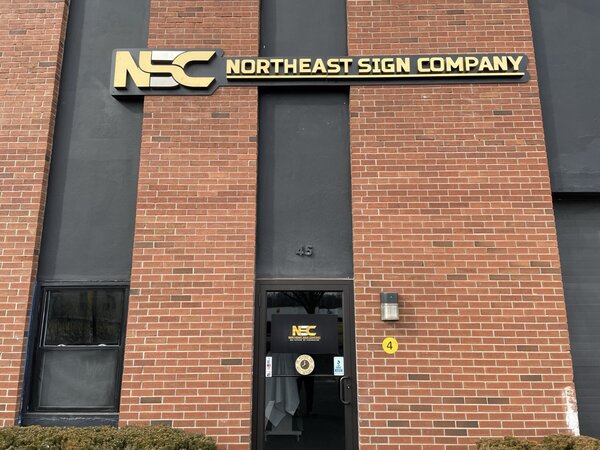Outdoor business sign of Northeast Sign Company
